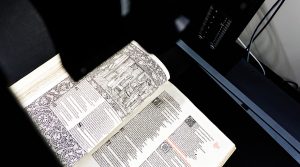 photo of the kelmscott press' works of geoffrey chaucer being digitized with a scanner camera